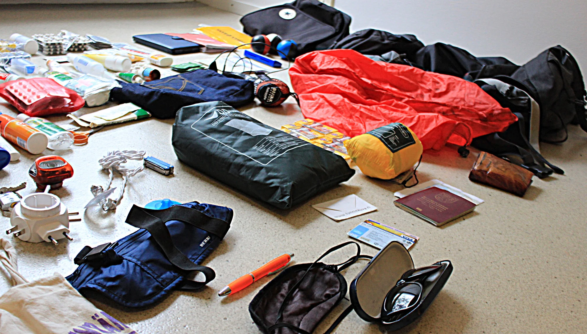 Travel equipment spread to cover the floor.