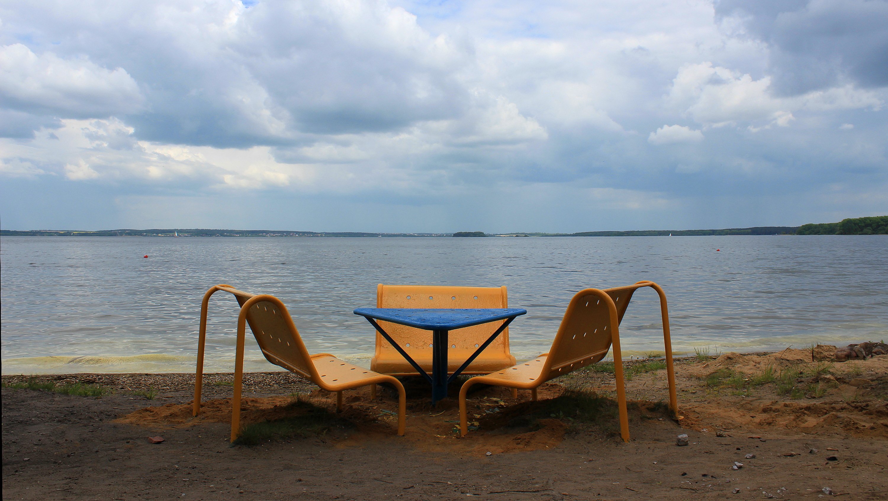 Chairs and a small table by the Minsk Sea, an artificial lake near Minsk.