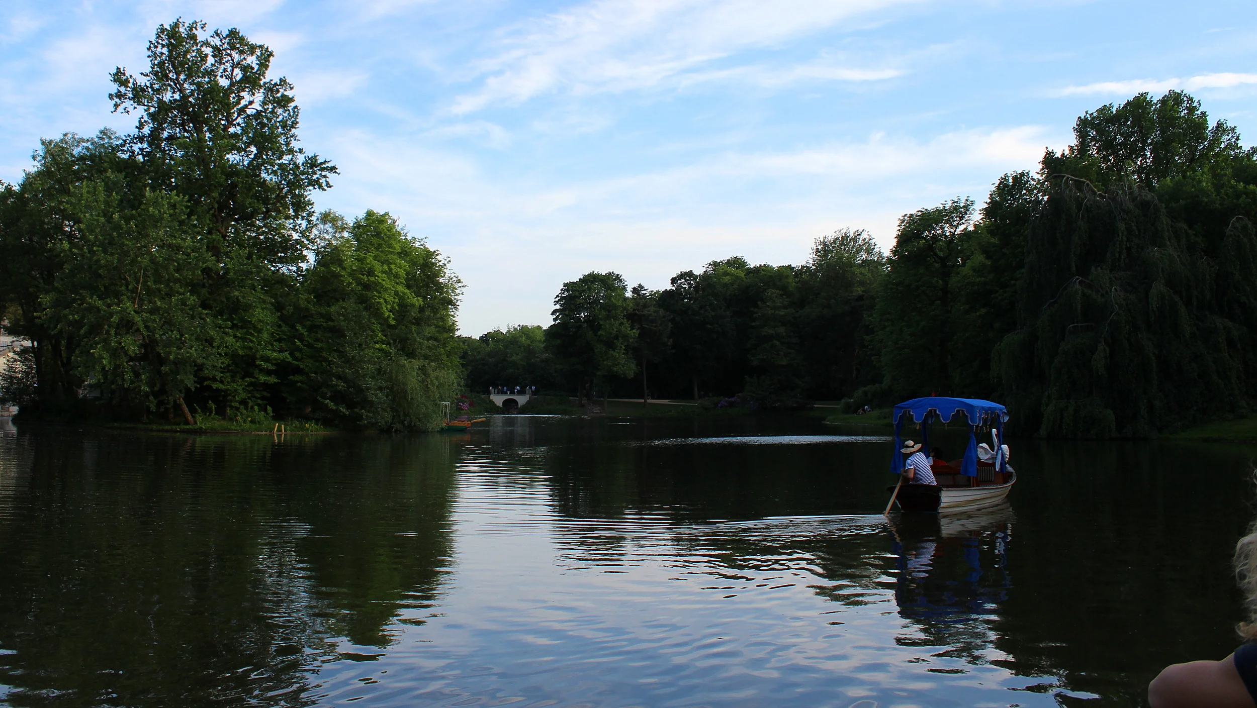 Visiting Poland for one week. Lazienki Park (Royal Baths Park) in Warsaw with a lake on a beautiful lake.