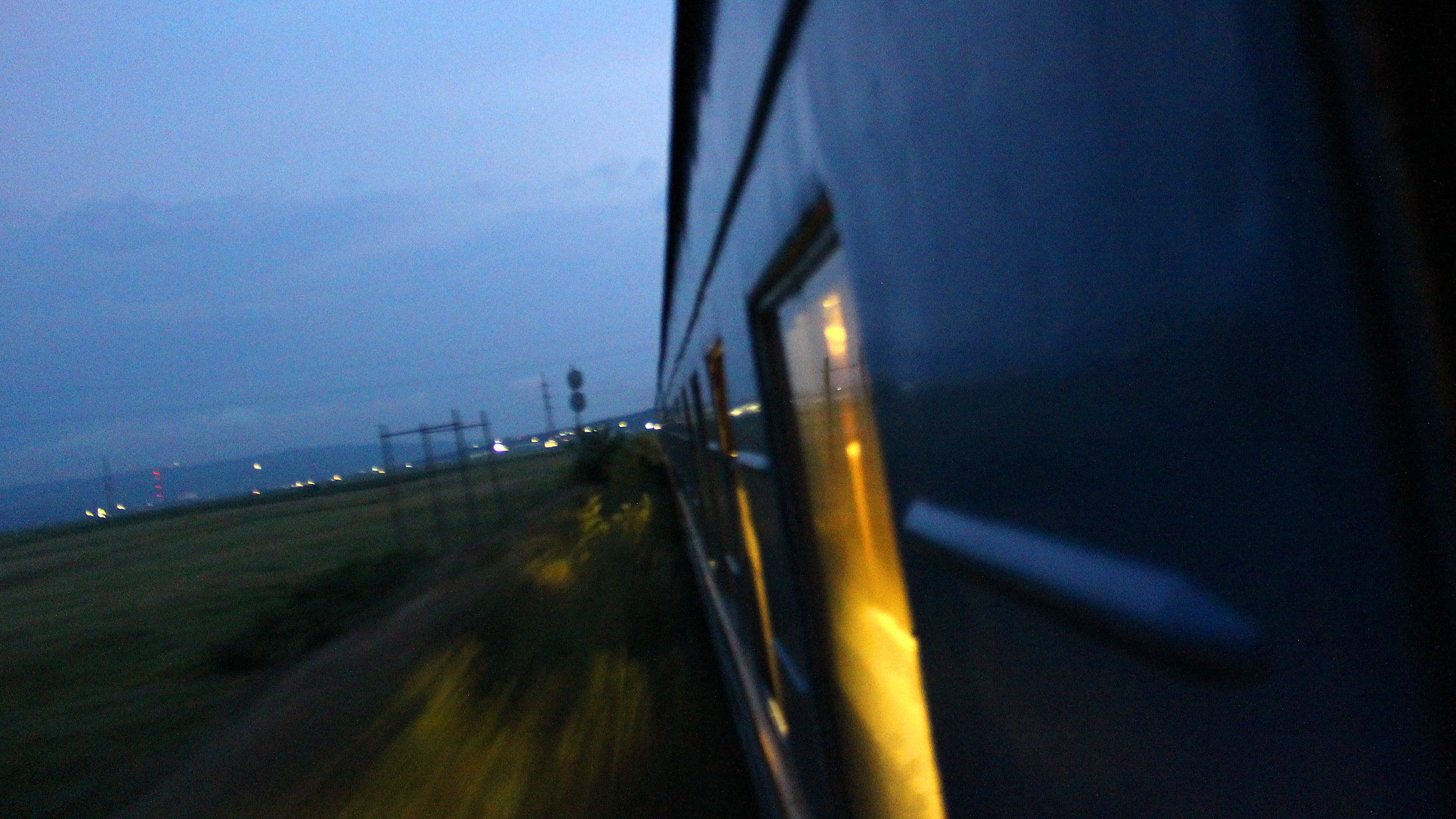 A night shot from the window of a train in Eastern Europe.
