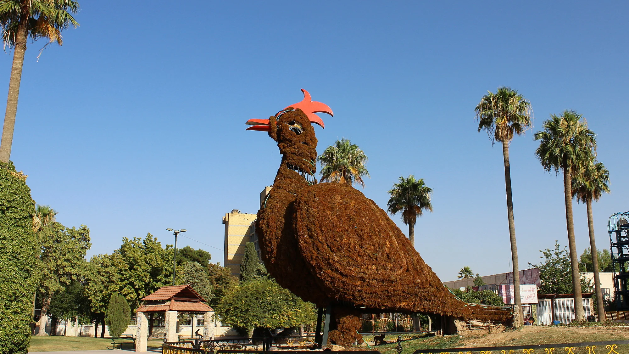 A giant chicken statue in a park in Shiraz.