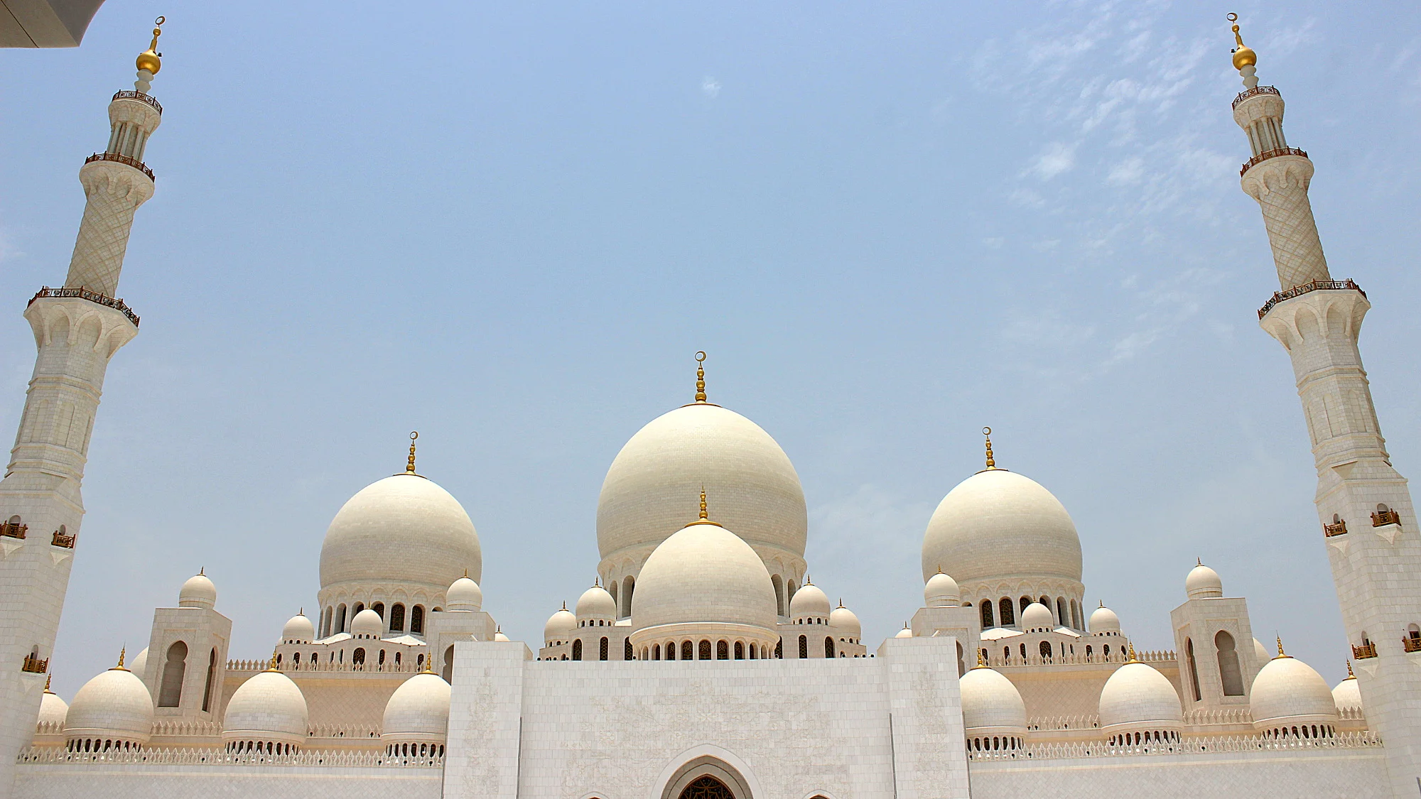 Front view of the Sheikh Zayed Mosque of Abu Dhabi in the summer.