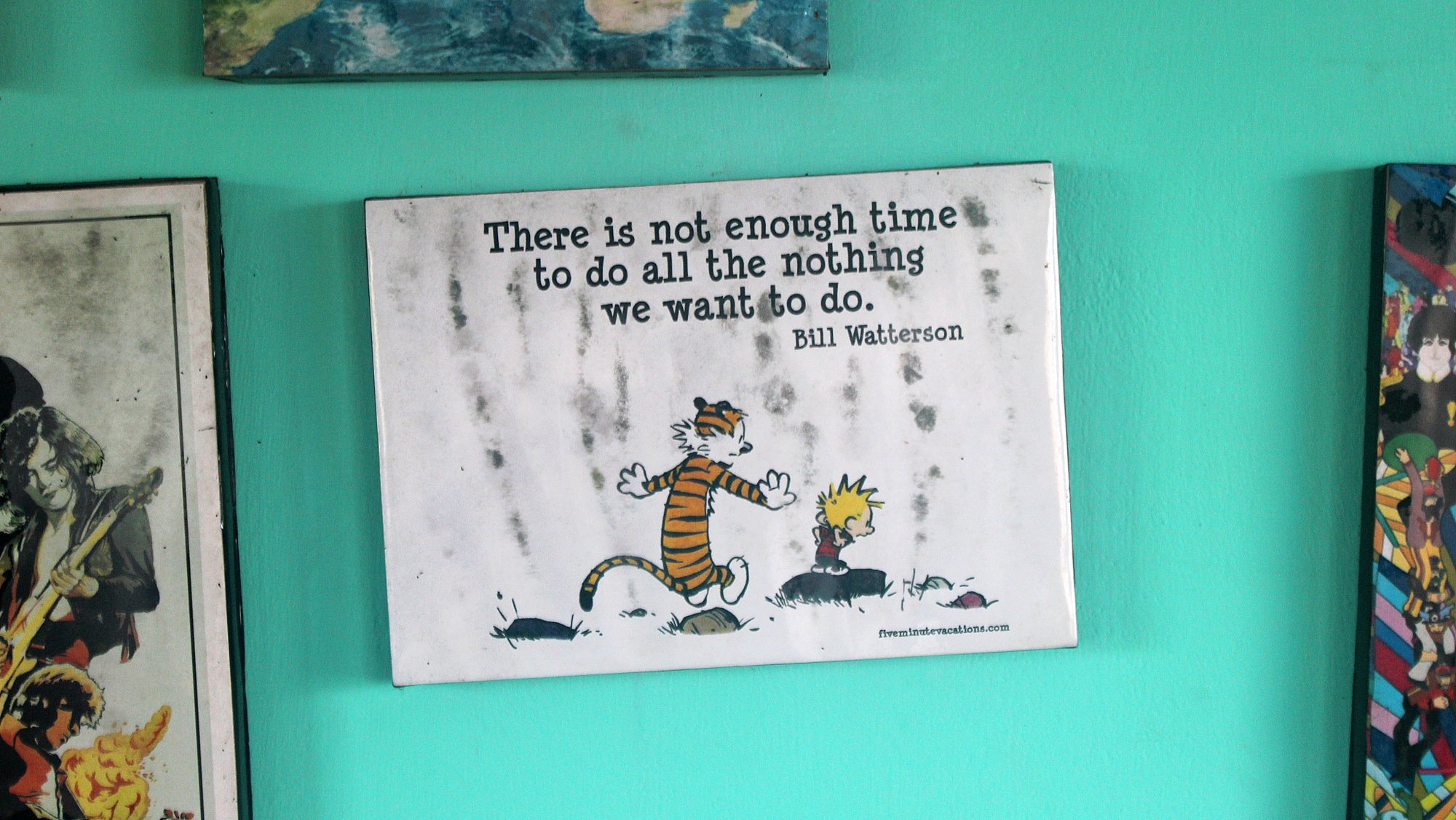 A Calvin & Hobbes print at the wall of the hostel Zostel Gokarna's with the quote "There is not enough time to do all the nothing we want to do." by Bill Watterson above the characters.