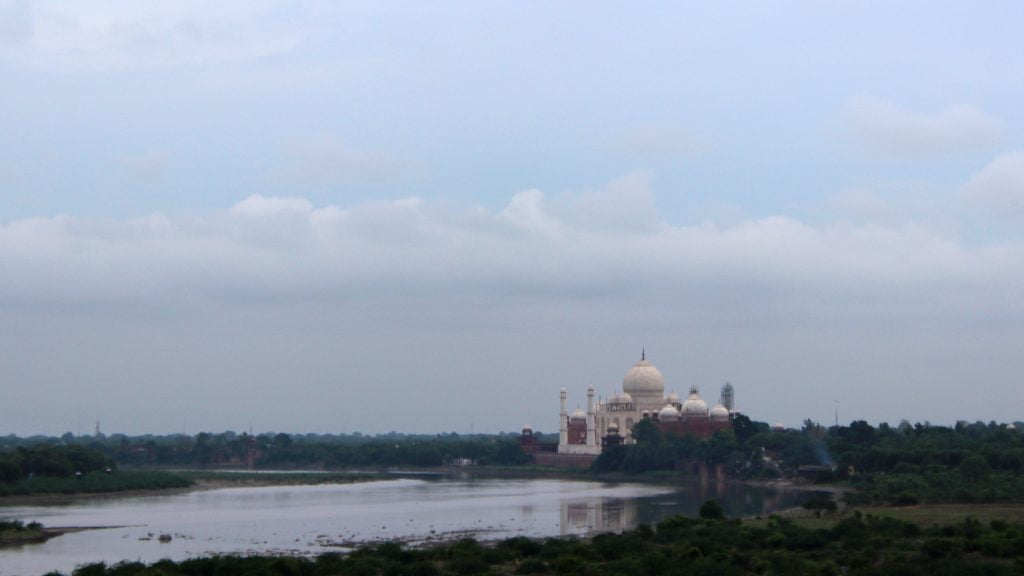 Taj Mahal as seen from the Agra Fort on a cloudy day.