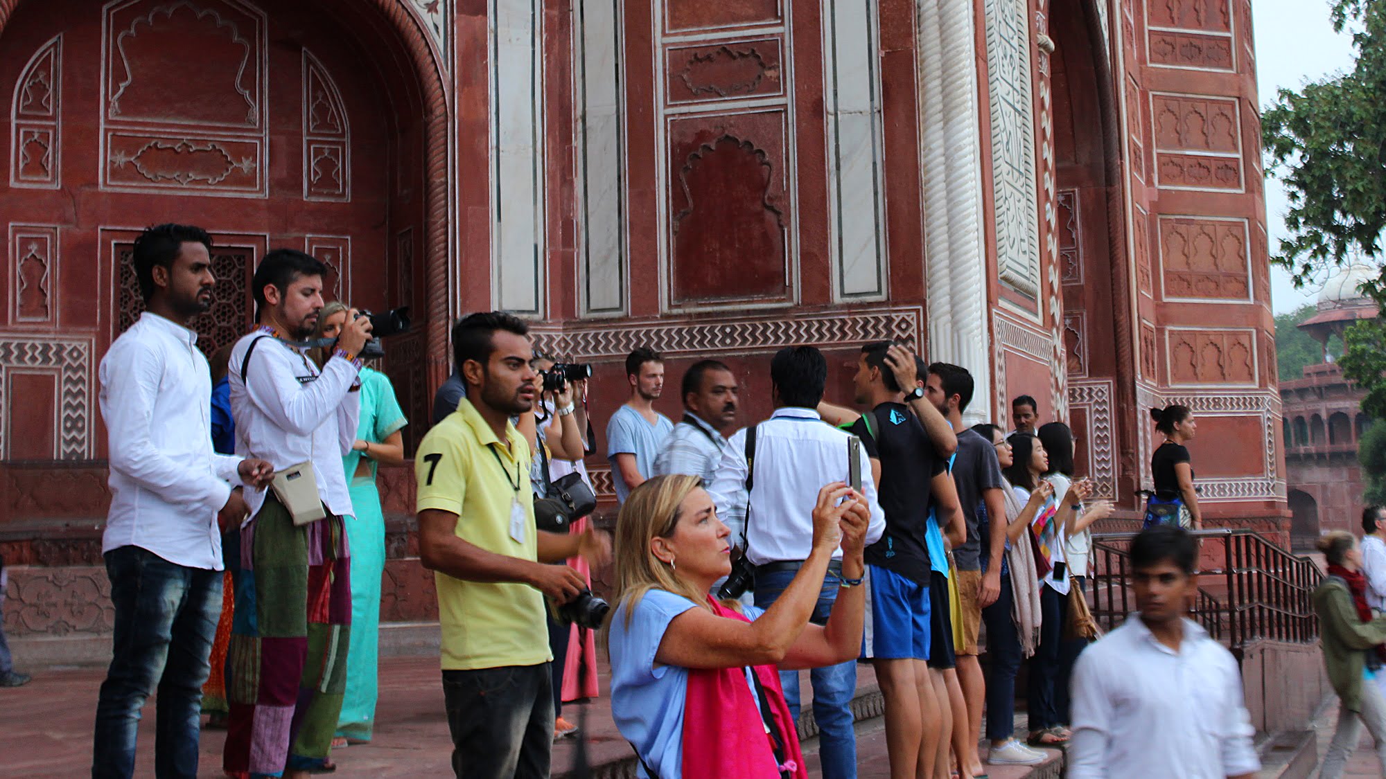 Taj Mahal Photography tips? Tourists taking pictures of Taj Mahal early in the morning.