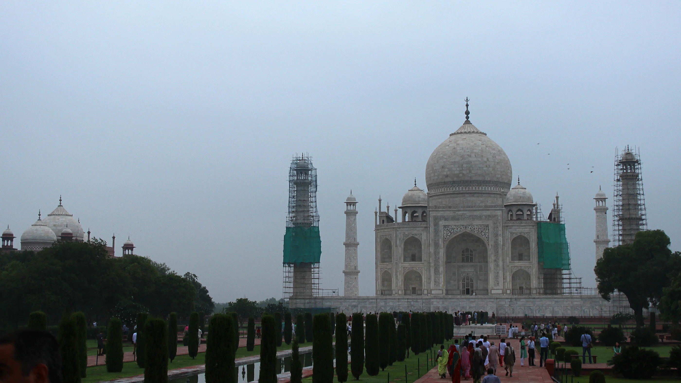 Alternative pictures of Taj Mahal: Here's the mausoleum on a cloudy morning with the front towers under renovation.