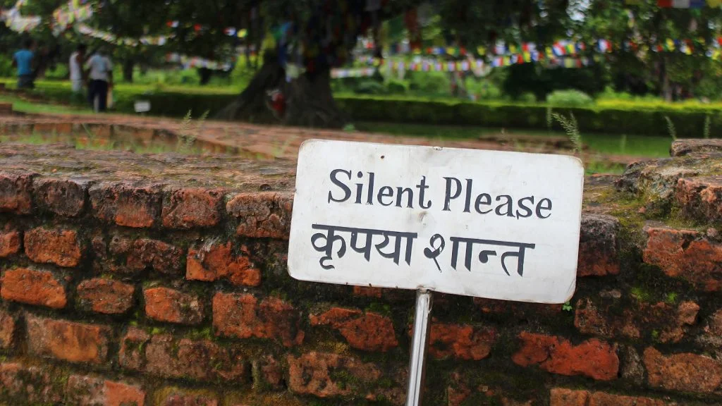 A sign near the birthplace of Buddha saying "Silence Please".