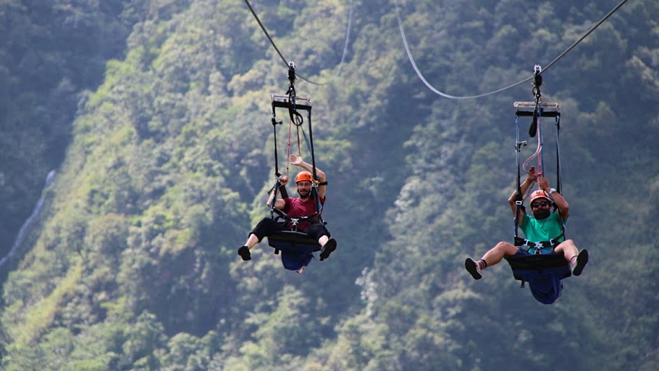 Gliding down on the HighGround Adventures ZipFlyer with Rabindra.