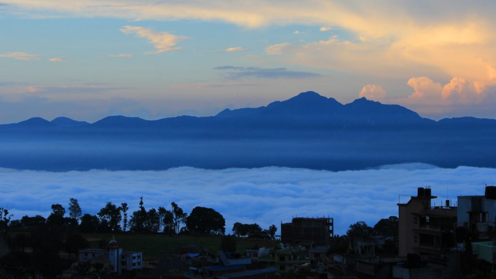 Sunrise above a cloudy valley below Tansen, Nepal.