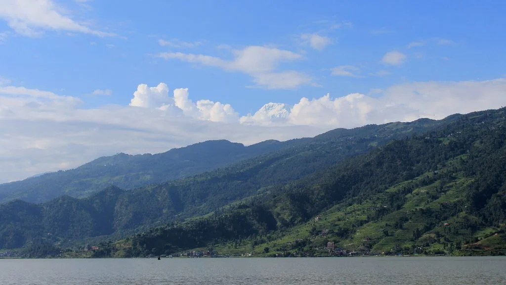 The peak of Annapurna South as seen from a boat in Phewa Lake Pokhara.