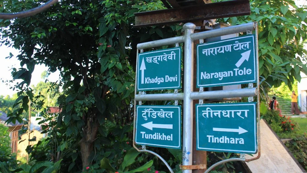 A sign pointing at different sights in Bandipur, Nepal.