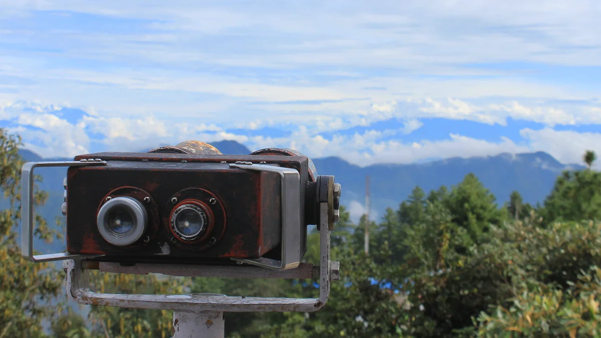 Best places to see the Himalayas in Nepal. Binoculars in the view tower of Daman, Nepal with the Himalayas in the background.