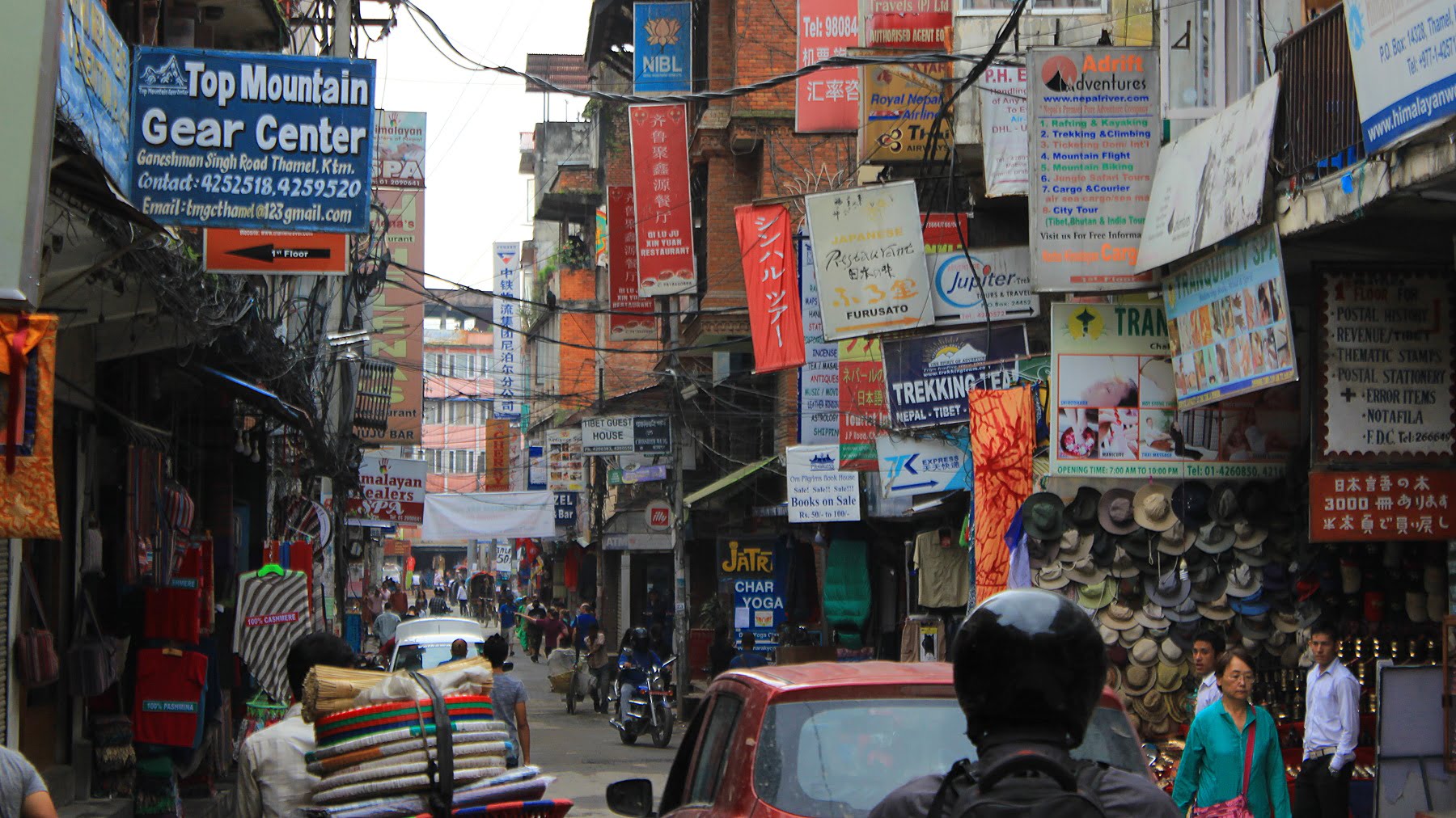 A street with plenty of business signs in Thamel, Kathmandu. I hate Thamel.