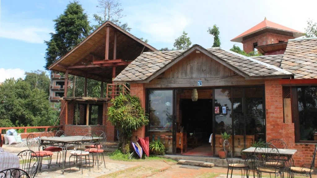 The yard of Hotel at the End of the Universe and the new main building with Mahakali temple in the background.