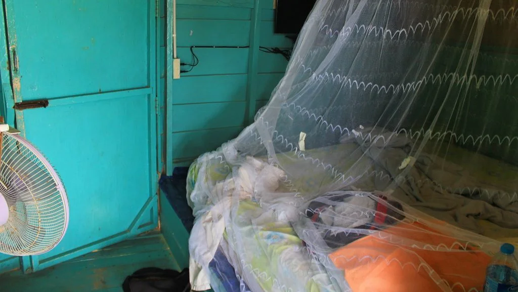 Mosquito net over a bed inside a tree house in Koh Samet, Thailand.