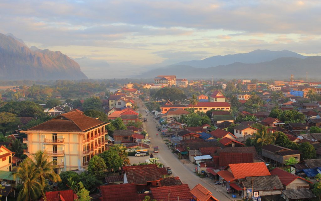 Streets of Vang Vien from hot air balloon during sunrise.
