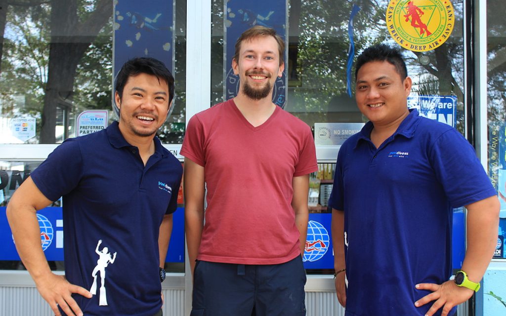 Arimo Koo with workers of Poni Divers diving school in Brunei.
