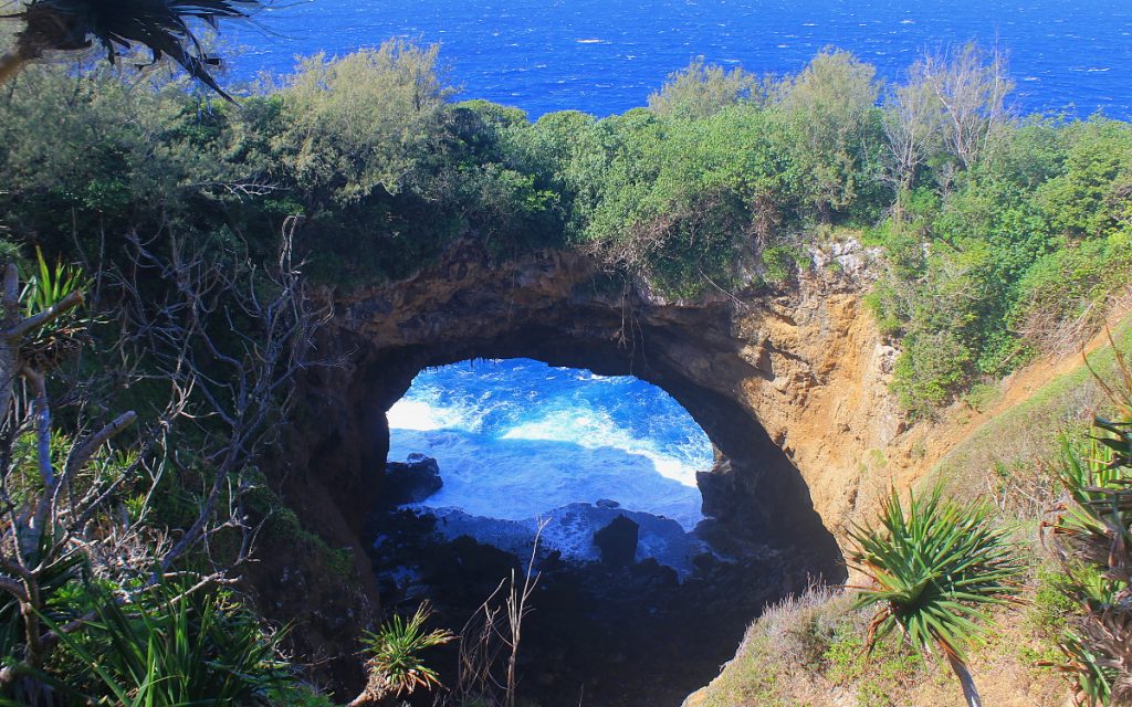 The natural rock archway of 'Eua Island, visited while hiking in Tonga.