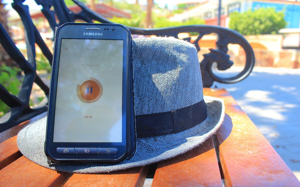 The Android app and a hat on a bench in Mexico.