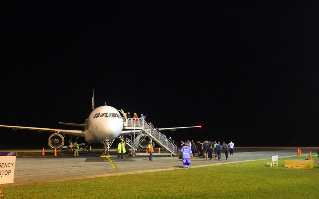 A flight boarding in Nuku'alofa airport, Tonga. Best travel tips for long-term travel.