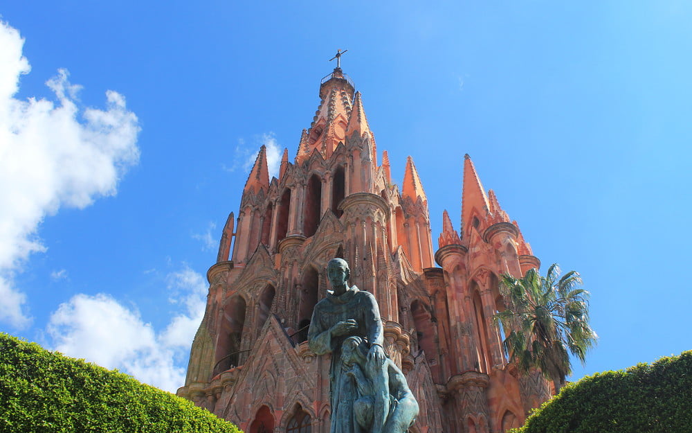 La Parroquia de San Miguel Arcángel and a statue in San Miguel de Allende, Mexico.