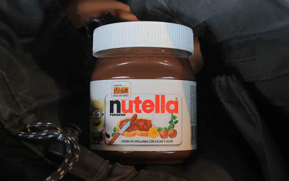 Nutella backpacker. a jar of Nutella in a backpack.
