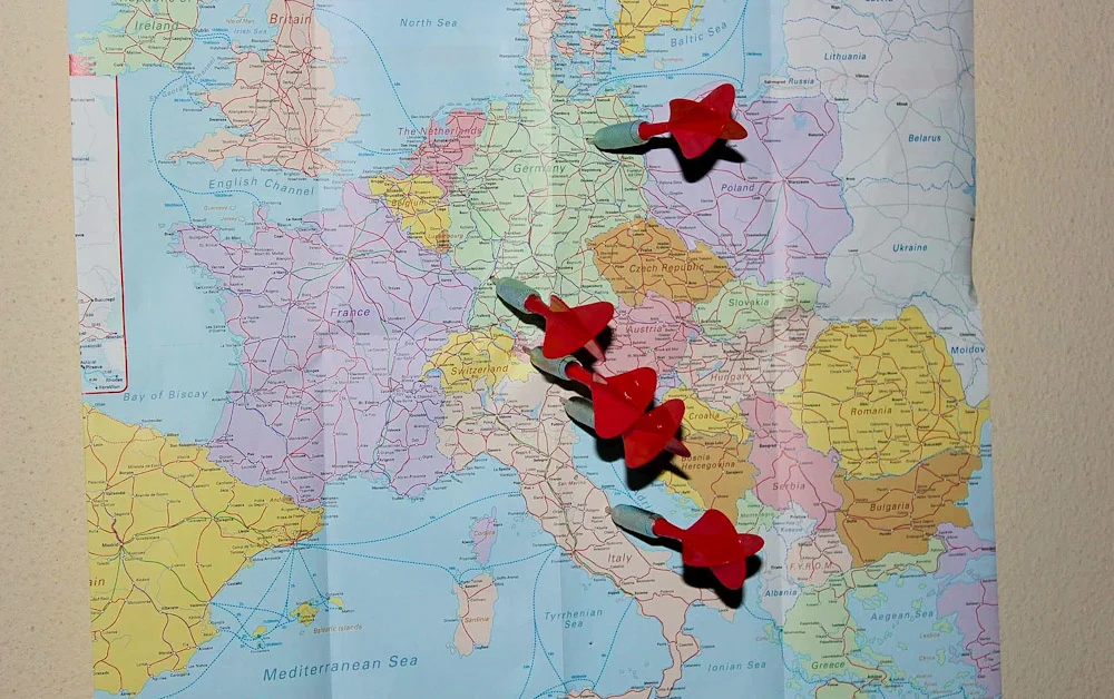 Throw dart at a map online. Throwing darts on the map of Europe to choose InterRail destinations.