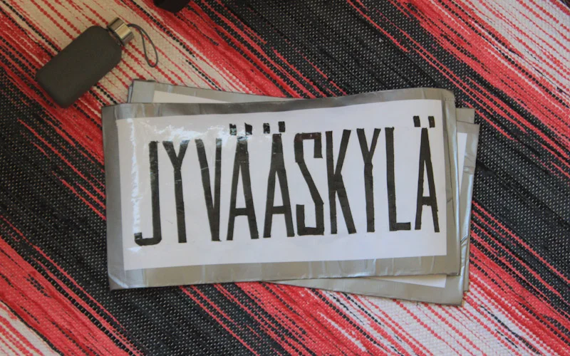 Hitchhiking in Jyväskylä, Finland. Jyvääskylä sign.