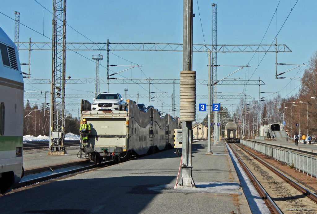 Taking a car to a night train in Finland.