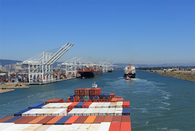 The speed of container ships, a cargo ship arriving in a harbor