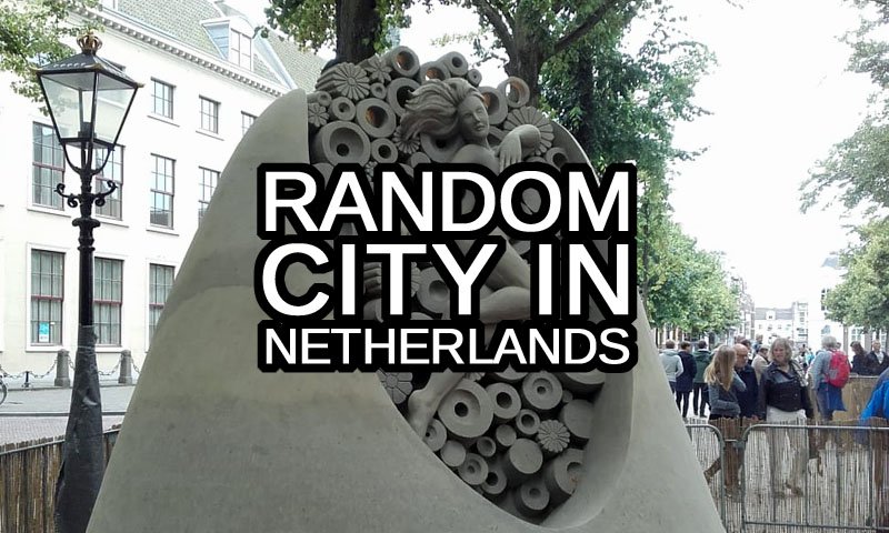 Random Dutch City in the Netherlands text with a sand castle in The Hague town in the background