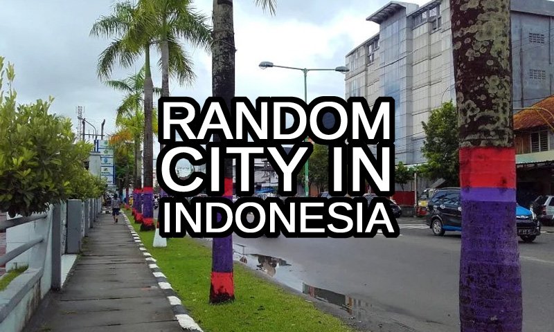 Random City in Indonesia text with a street in the town of Tarakan, Kalimantan in the background
