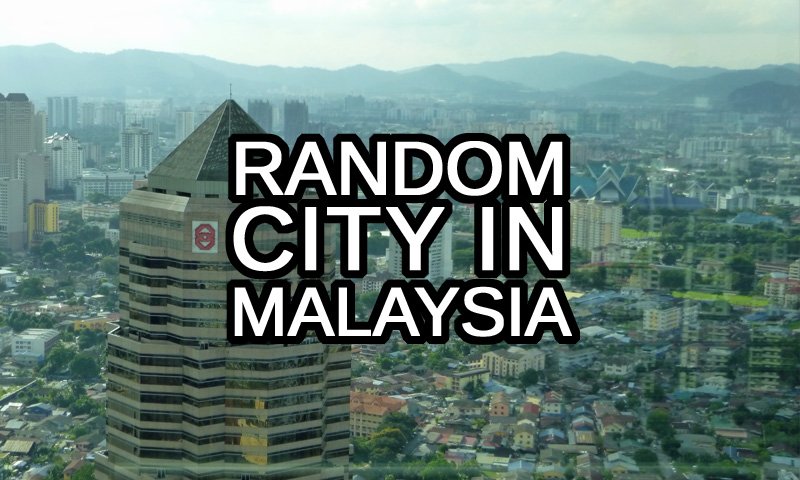 Random City in Malaysia Generator text with a view of Kuala Lumpur from Petronas Twin Towers in the background