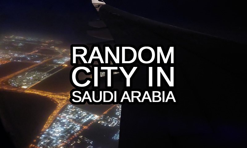 Random City in Saudi Arabia text with a random Saudi town as seen from an airplane in the background